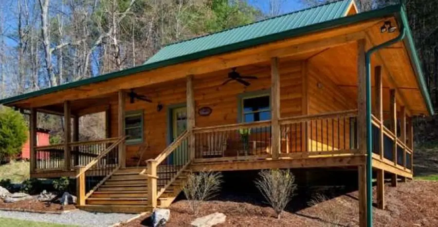 Step Away from Stress and Enjoy Life in a Secluded Log Home with Wraparound Porch