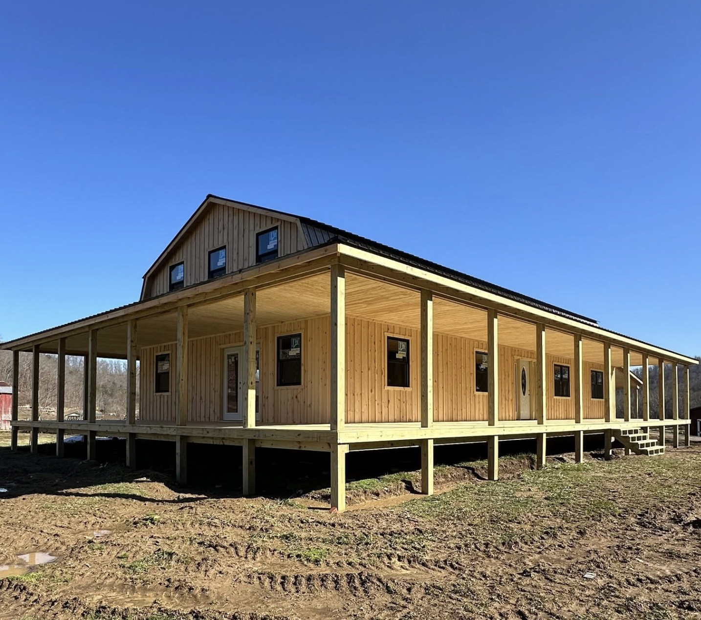 Explore a 30×60 Amish Gambrel Cabin with 3-Sided Wraparound Porches