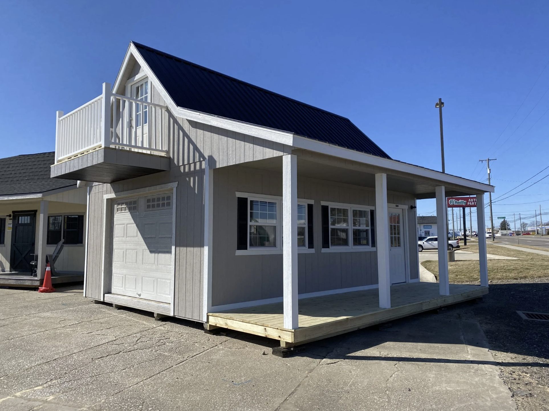 Two-Story 16×24 Gable Cabin with Porch and Balcony Design