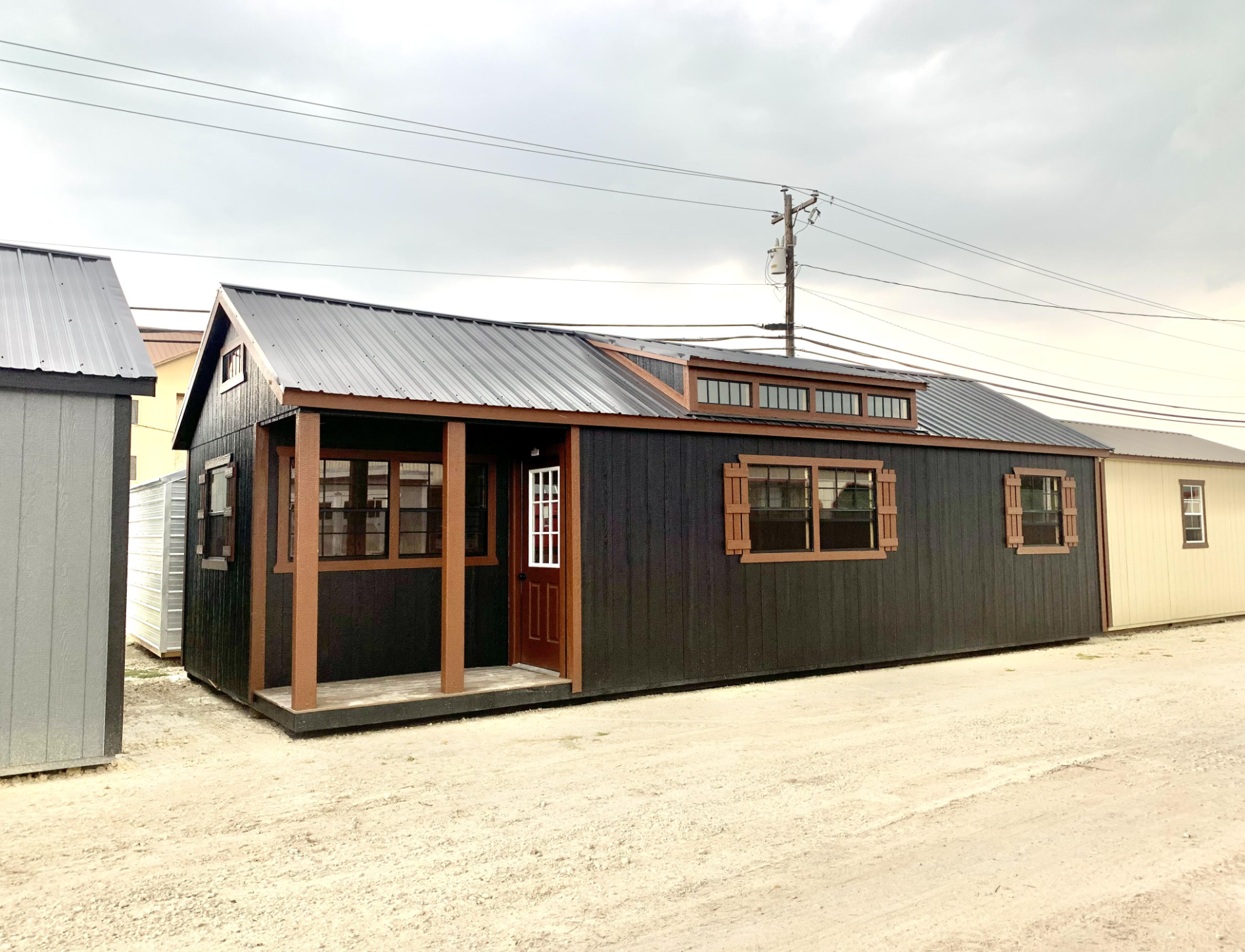 Stunning 14×36 Black Side Porch Cabin for Less Than $20,000